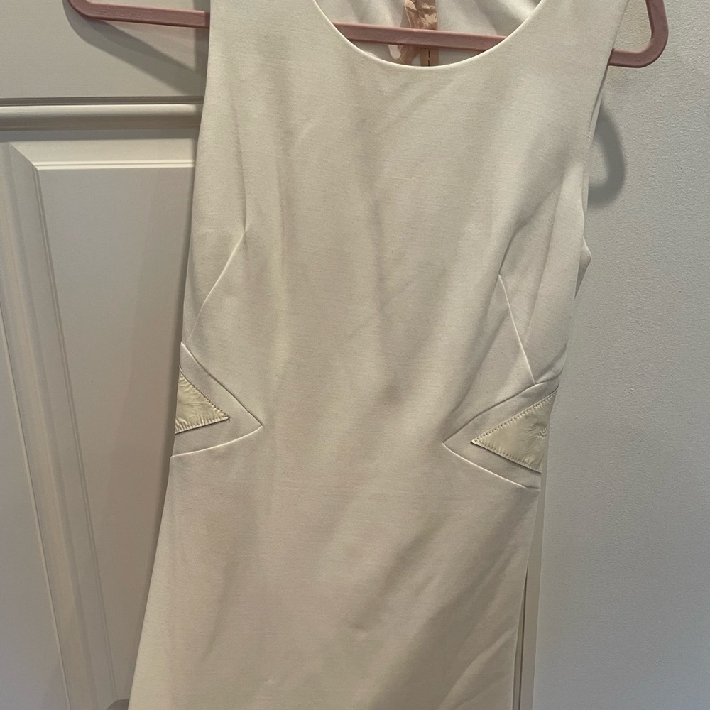 Bailey 44 white mini dress with back cut out and patent leather detail